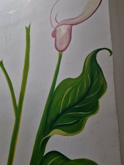 Rising Stems: Slender stems and a single bloom, part of the calla lily corner wall.