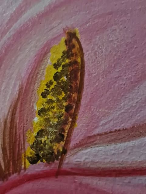 Close-up of painted calla lily detail in ochre and pink